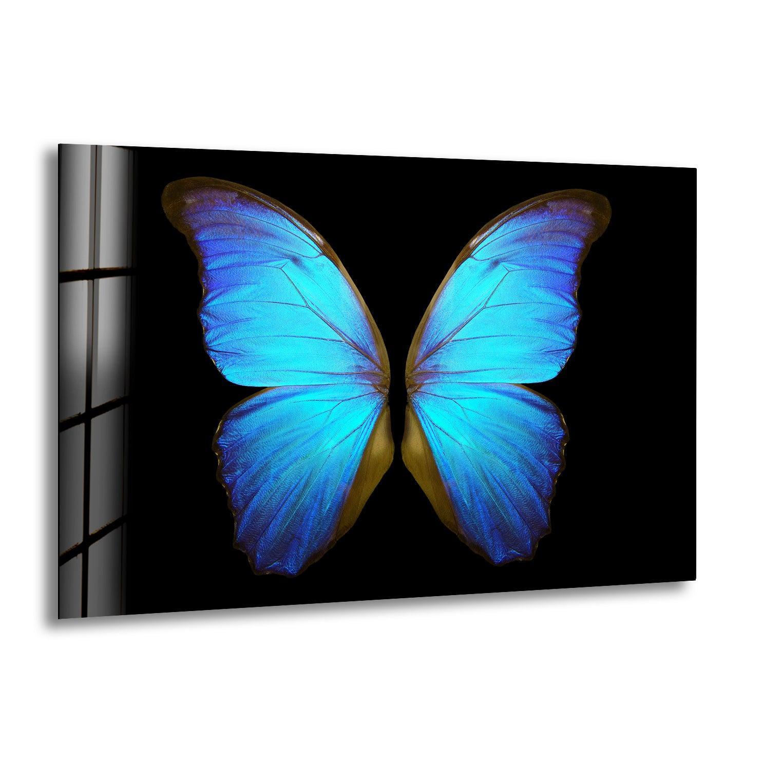 Smooth, iridescent blue butterfly wings shimmer with intricate texture on this piece of art from glass.
