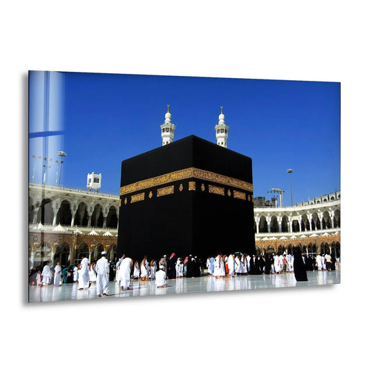 Religion glass wall art showing Mecca Kaaba Art and Islamic religious decor with its 8K UV printing tempered finish against a blue sky