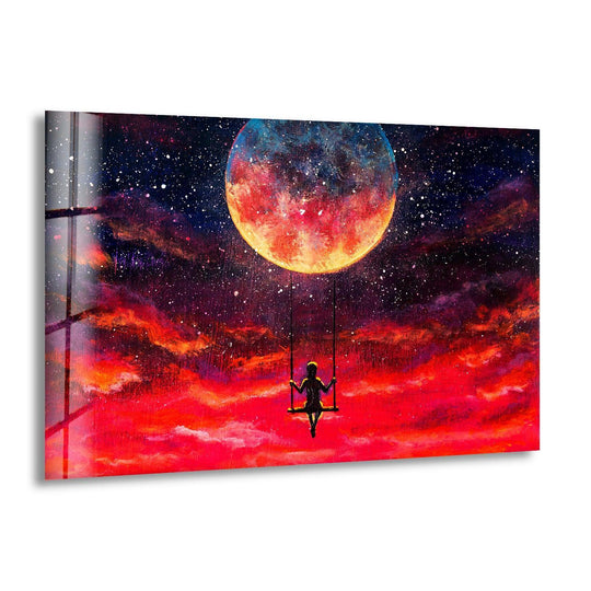 A solitary figure on a swing gazes at the vibrant color transition from deep space blues to fiery reds on a glass wall art decor.