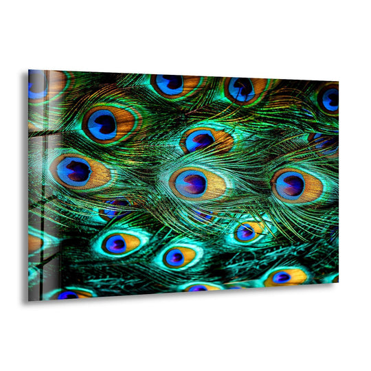 Vibrant peacock feather glass wall art decor explodes with the loudest, most brilliant sapphire and emerald hues.