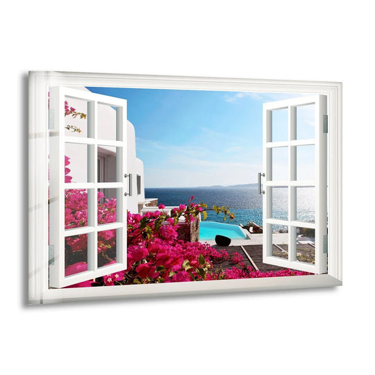 With high color saturation, this hanging wall art features a vibrant Santorini window view showcasing the vivid pink flowers and dazzling blue Aegean Sea.