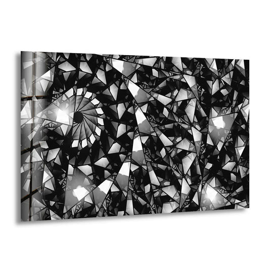 Monochromatic abstract glass wall art decor depicts a shattered, crystalline geometric pattern with sharp angles and bright light reflections.