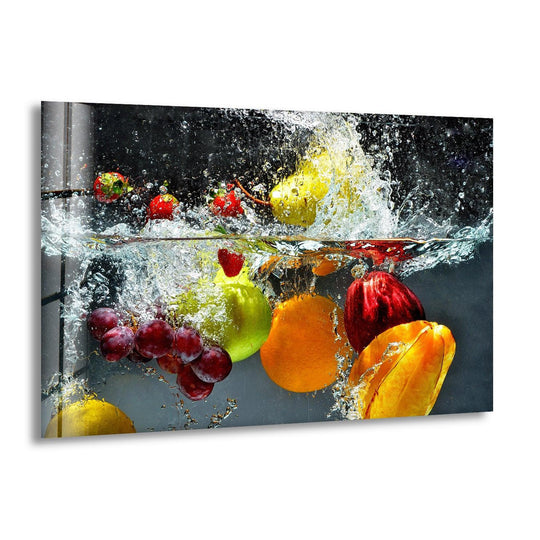 Vibrant fruits falling into water splash glass wall art featuring red grapes green apples and yellow pears in a horizontal glossy finish.