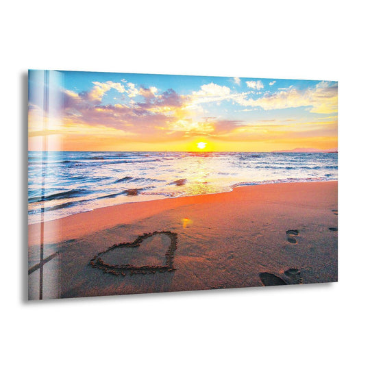 Landscape glass wall art romantic sunset on the beach with heart drawn in sand and sunset wall art providing serene coastal print decor