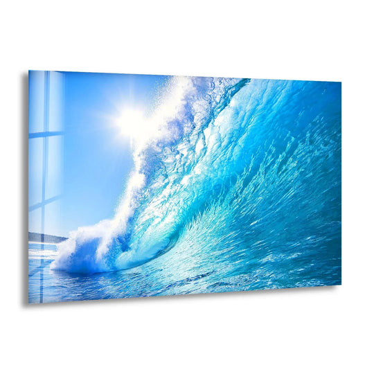 Huge ocean waves glass wall art shows a bright blue ocean wave and it is ocean wave glass decor and stunning sea wall art for coastal decor lovers