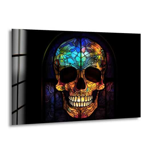 Dark shadows frame a vibrant Gothic skull glass printing with intricate floral patterns and a gothic window design.