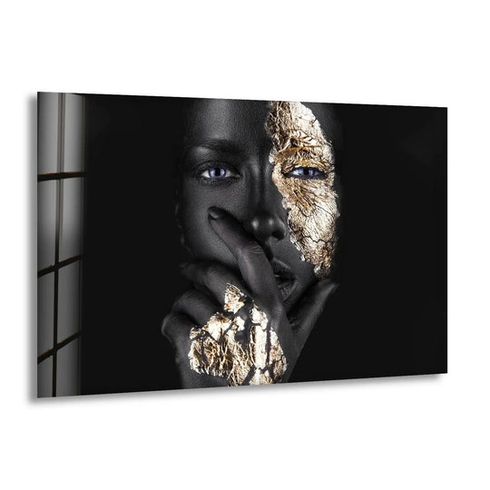 A striking visual rhythm of black skin and shimmering gold leaf adorns this woman's face, creating captivating wall prints.