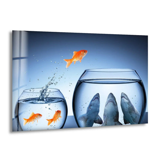A courageous goldfish leaps from a smaller bowl to a larger one, escaping three hungry sharks, as striking glass wall artwork.
