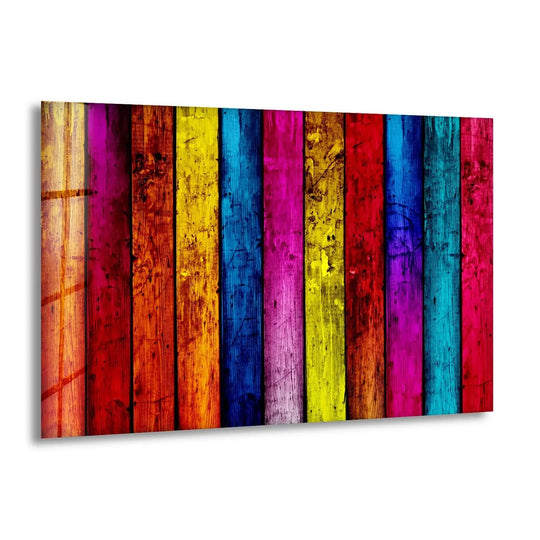 A vertical arrangement of vibrantly colored, weathered wooden planks creates abstract decorative wall art with ample negative space.
