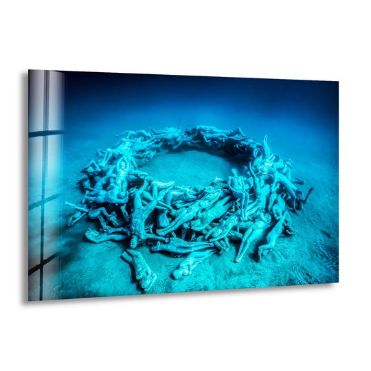Serene art from glass captures the profound stillness of submerged sculptures in a captivating circular formation.