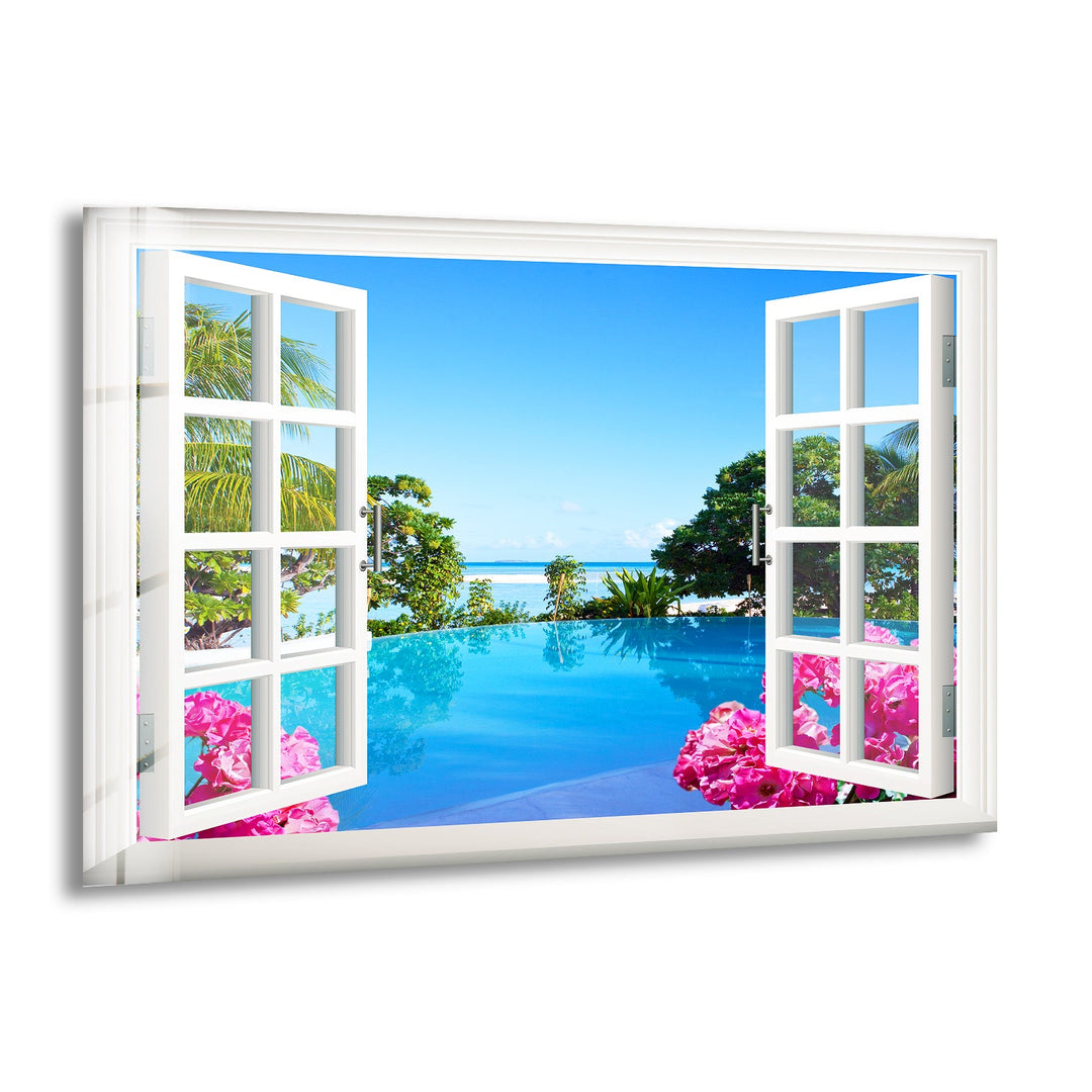 Open window view of a tropical paradise with a pool and ocean in the background.

