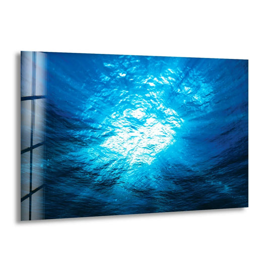 Ocean deep water glass wall art shows a brilliant underwater view and blue tones and is stunning ocean decor and coastal wall art and scenic glass art