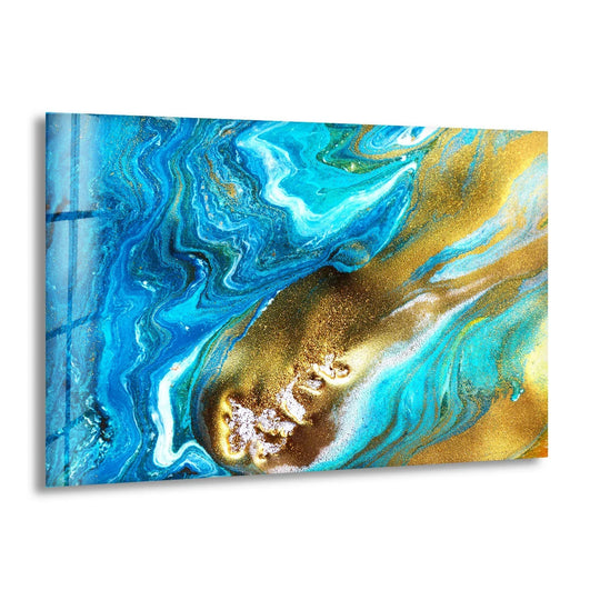A horizontal rectangular glass art piece with fluid abstract shapes of blue, white, and gold ink.