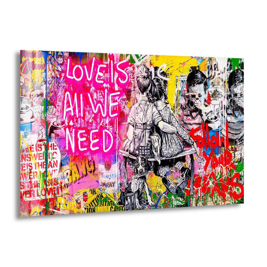 Banksy glass wall art displays a couple embracing and features vibrant colors and graffiti style with the message Love is All We Need and modern art prints