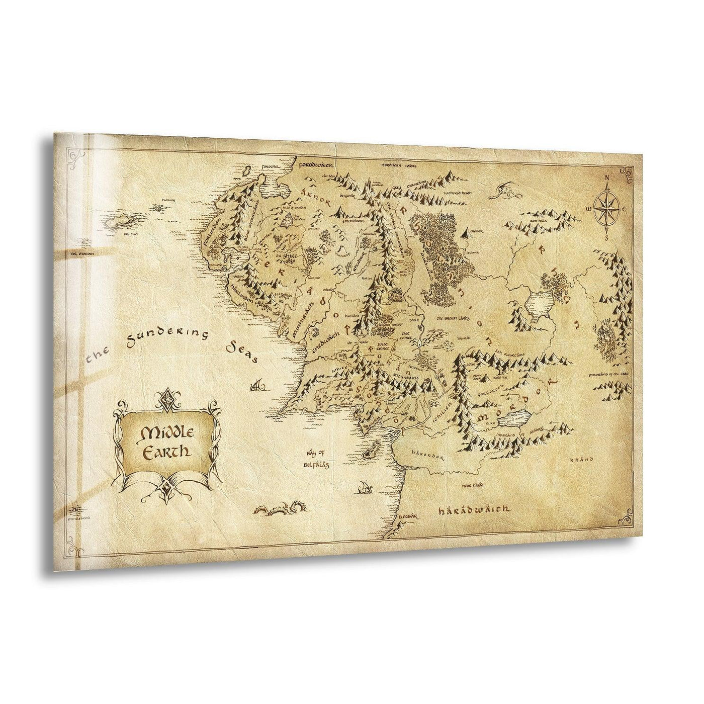 High color contrast highlights the vintage Middle Earth map on this tempered glass print wall art, evoking a sense of classic fantasy.