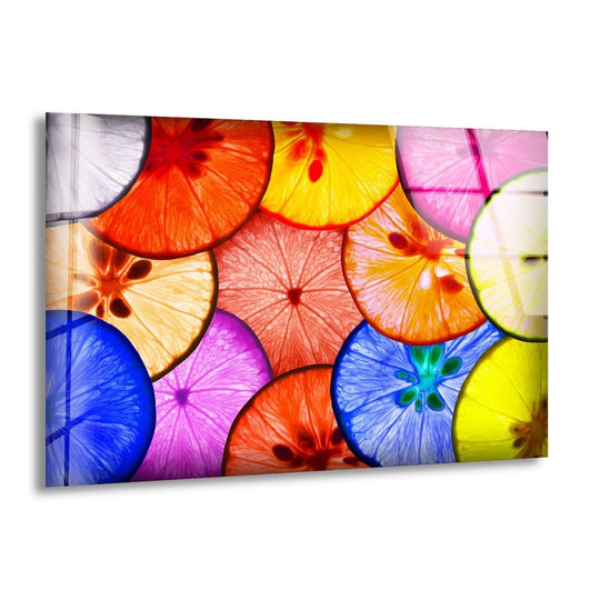 The brightest area of this colorful lemon glass wall art decor features glowing yellow and pink citrus slices with vibrant veins.