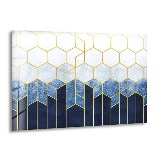 Abstract glass wall art decor transitions from deep navy blue to lighter blues and white with gold geometric lines.