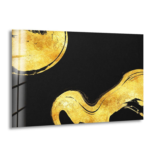 A circular swirl of soft gold foil on black abstract glass wall art creates unique modern wall decor.