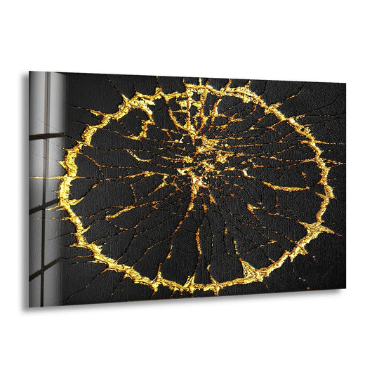 Abstract art from glass depicts a radiating gold crack pattern against a deep black negative space.