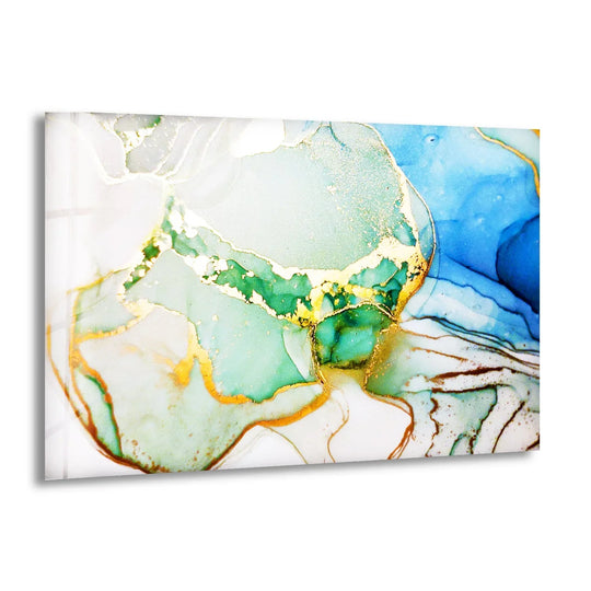 The brightest area of this abstract glass wall art features shimmering gold veins amidst soft blue and aqua hues.