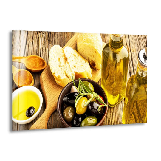 Horizontal glass wall art depicting olives, bread, and olive oil bottles, ideal kitchen wall decor with warm golden and brown tones.