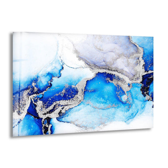 Abstract glass wall art with swirling navy blue and white ink detailed with shimmering silver flecks for home decor.