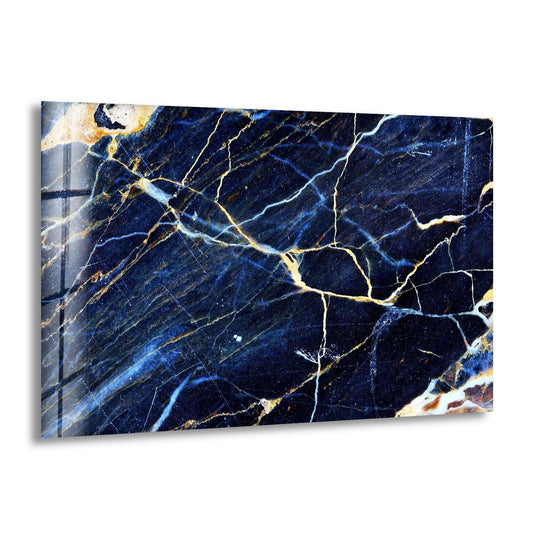 A cool-toned abstract decorative wall art piece features deep navy blues and icy white veins with warm golden accents.