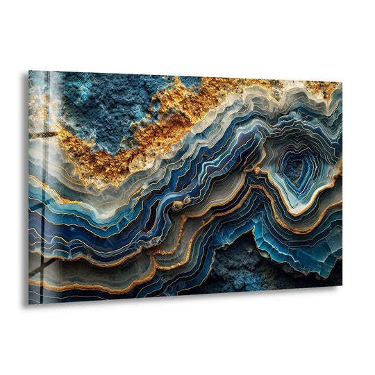 Shadows deepen within the luminous layers of this blue and gold abstract glass wall art, revealing intricate details.