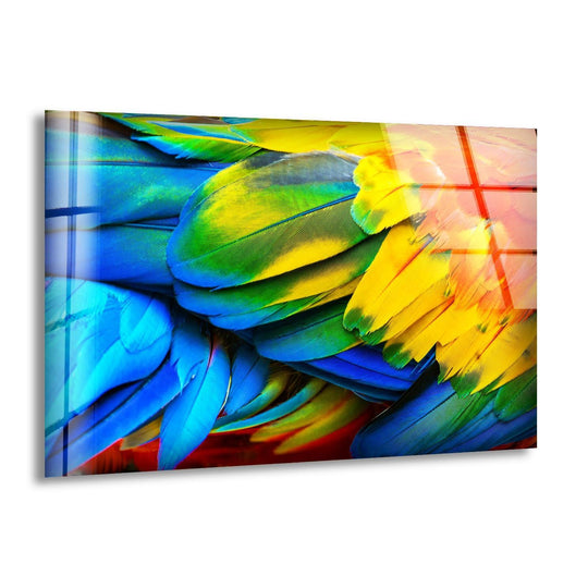 Dark sapphire blue and emerald green parrot feathers form a lush texture in this vibrant glass art.