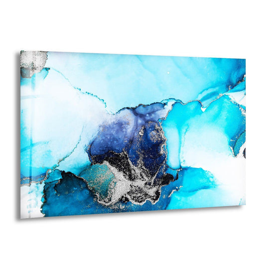 Soft wisps of sapphire and azure blend into white, accented by shimmering silver in this captivating glass wall art decor.
