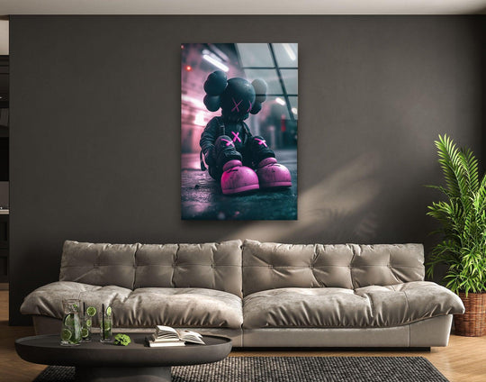 Kaws Grey and Pink glass wall art shows a black figure with pink accents and makes a cool art piece with vibrant colors and durable quality and is urban pop decor