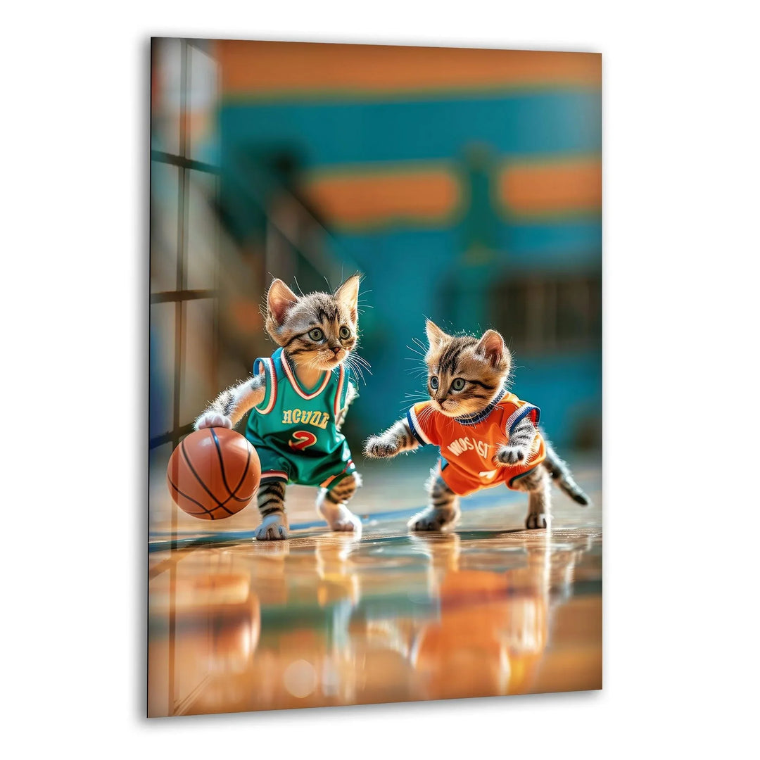 Playful glass wall art featuring two kittens in basketball jerseys playing with a ball on a court.