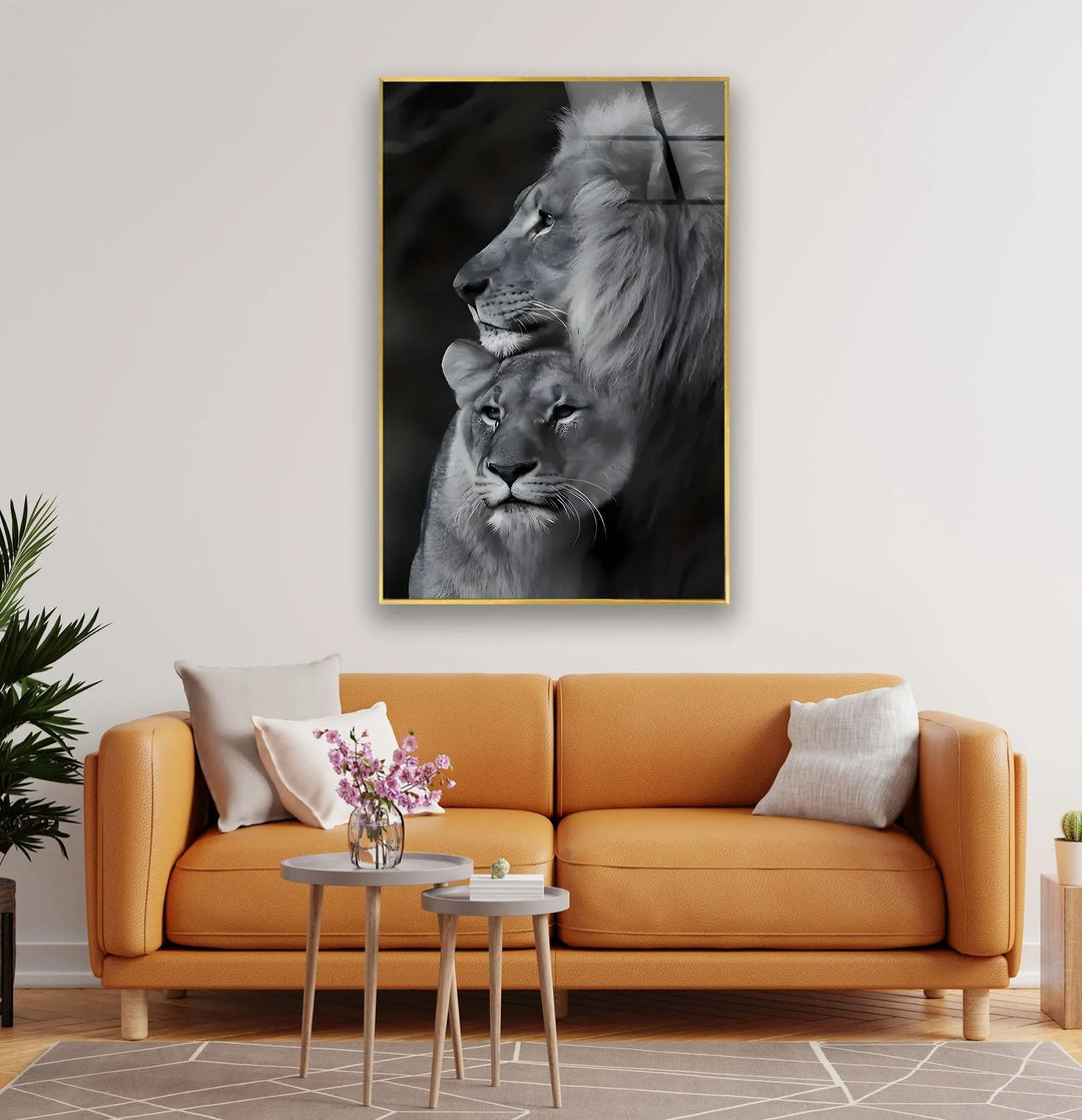 Elegant lion and lioness composition in grayscale on tempered glass with soft shadows.