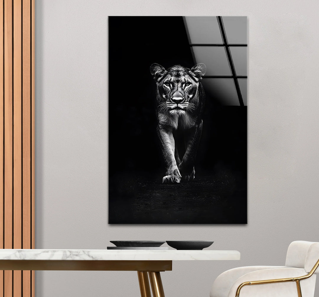 Fierce lion walking toward viewer in grayscale artwork.