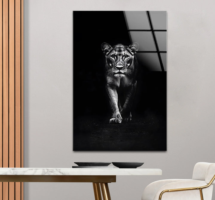 Fierce lion walking toward viewer in grayscale artwork.