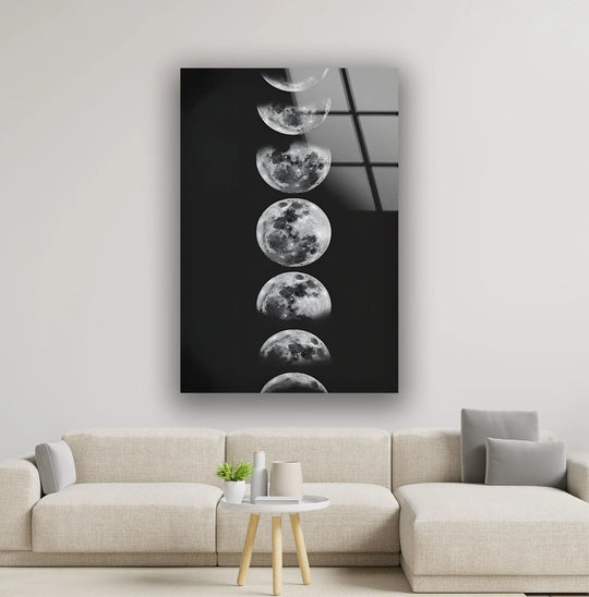 Space wall art vertical glossy glass wall art with moon phases and moons plus space picture prints on a white wall