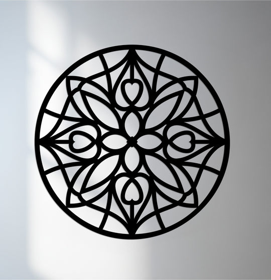 The realistic detail shows an intricately cut, circular mandala metal wall decor featuring repeating heart shapes and geometric patterns, perfect for adding an elegant touch.