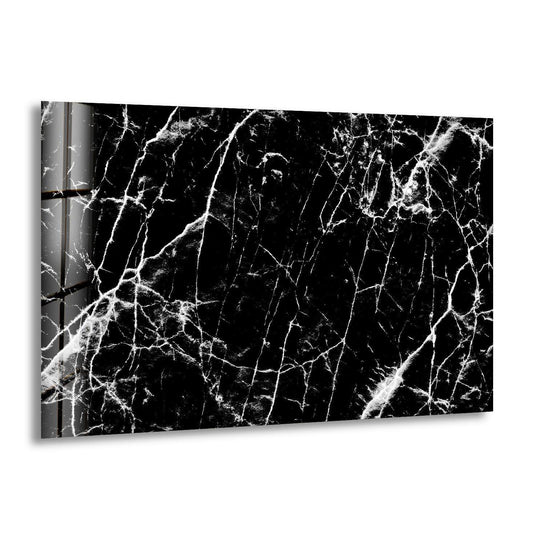 Black marble texture with bold white veining printed on modern glass wall art.