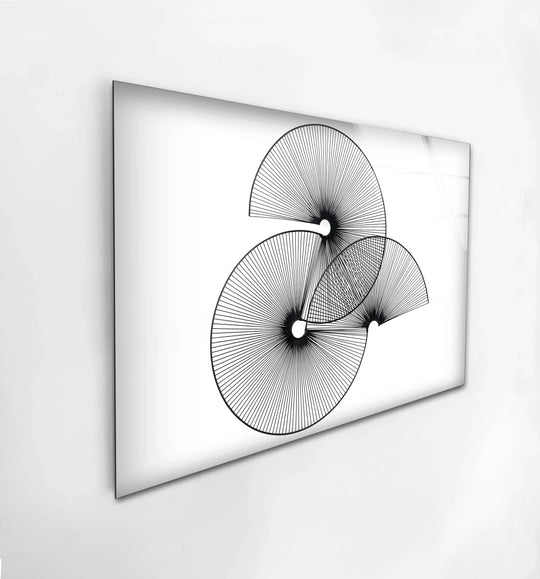 A horizontal tempered glass wall art featuring abstract black and white geometric circles arranged in a dynamic, overlapping formation.