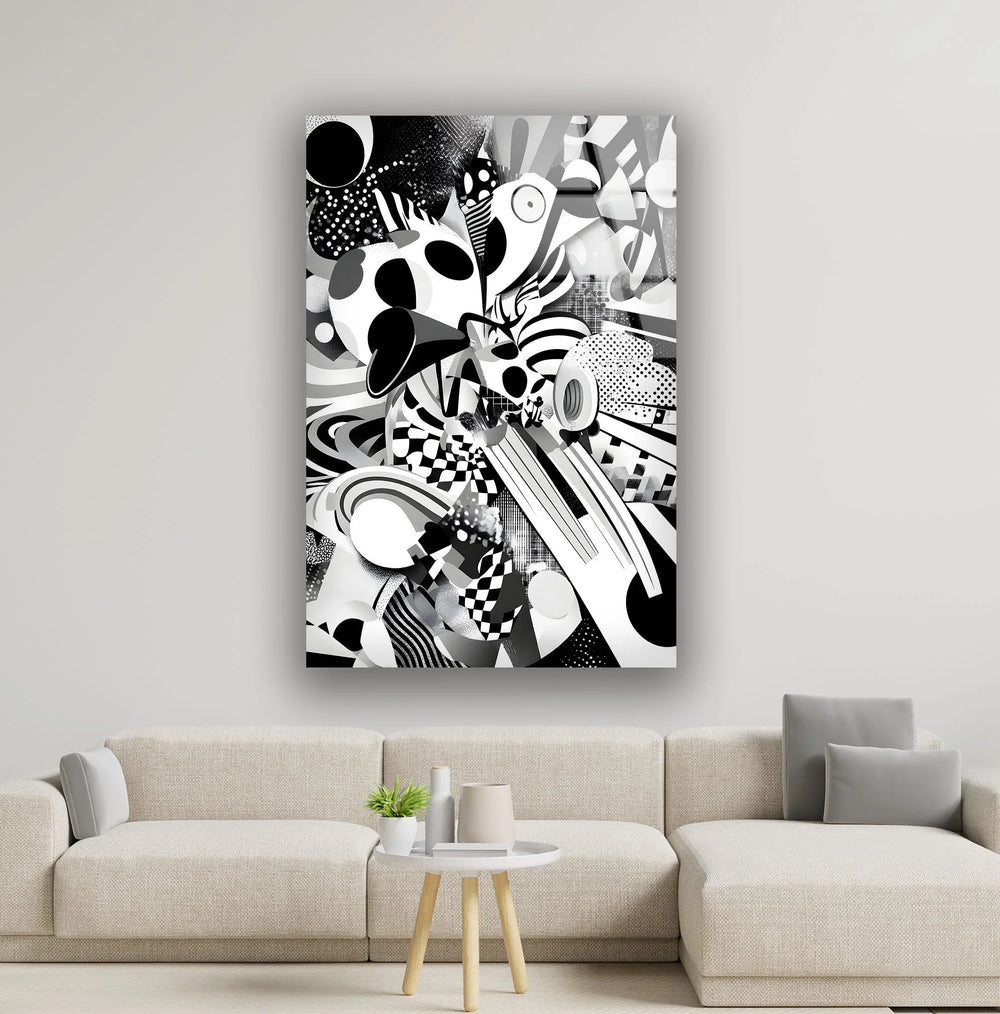 Monochrome abstract glass wall art with layered circles, stripes, and checkerboard textures creating energetic motion.