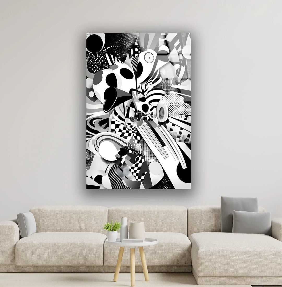 Monochrome abstract glass wall art with layered circles, stripes, and checkerboard textures creating energetic motion.
