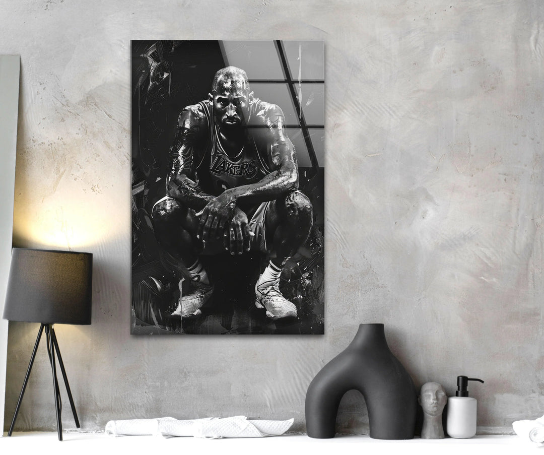 Intense black and white basketball artwork on tempered glass depicting an athlete in a gritty crouched stance.