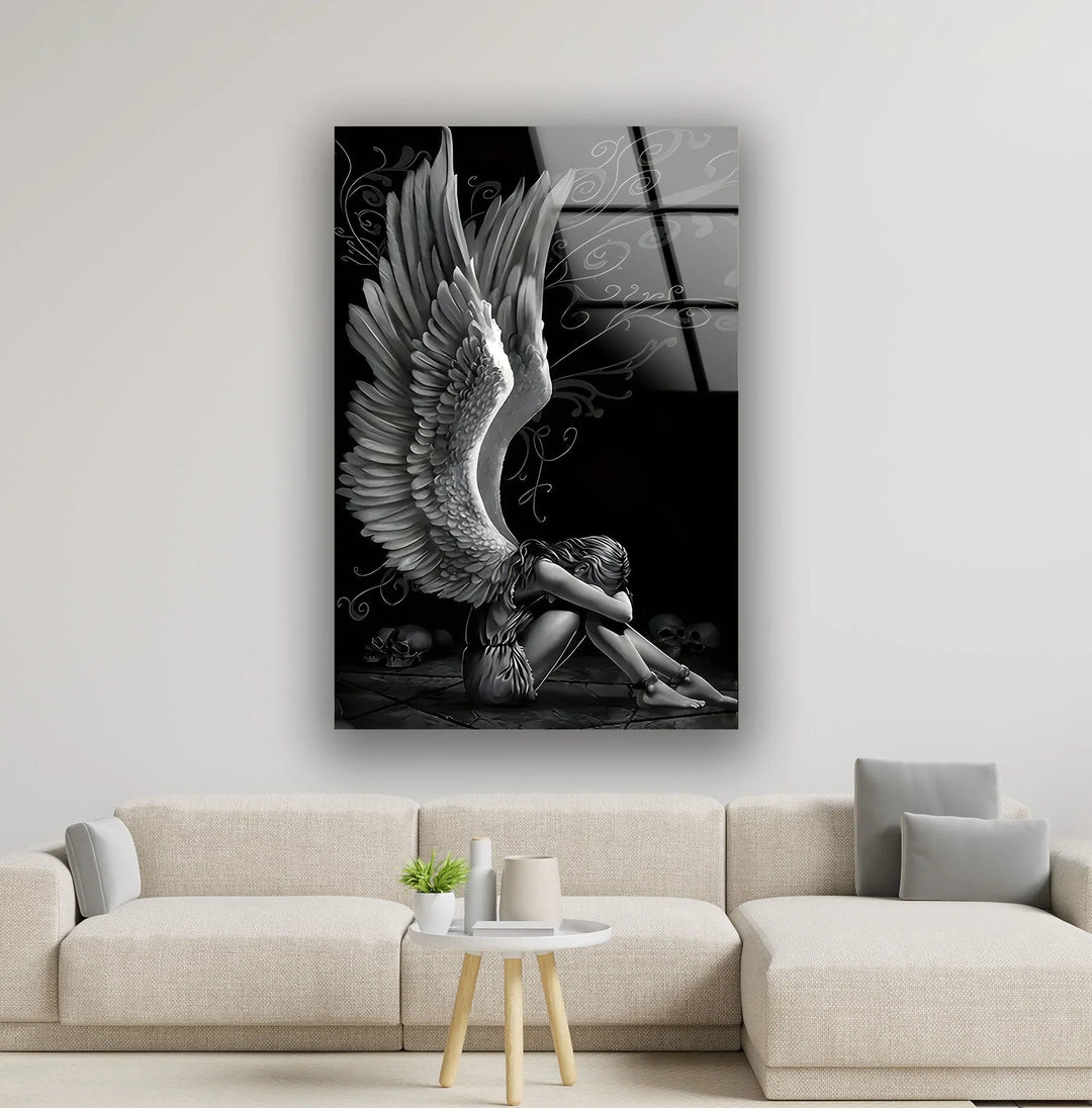 Monochrome angel artwork on tempered glass showing a winged figure curled up in an emotional pose.
