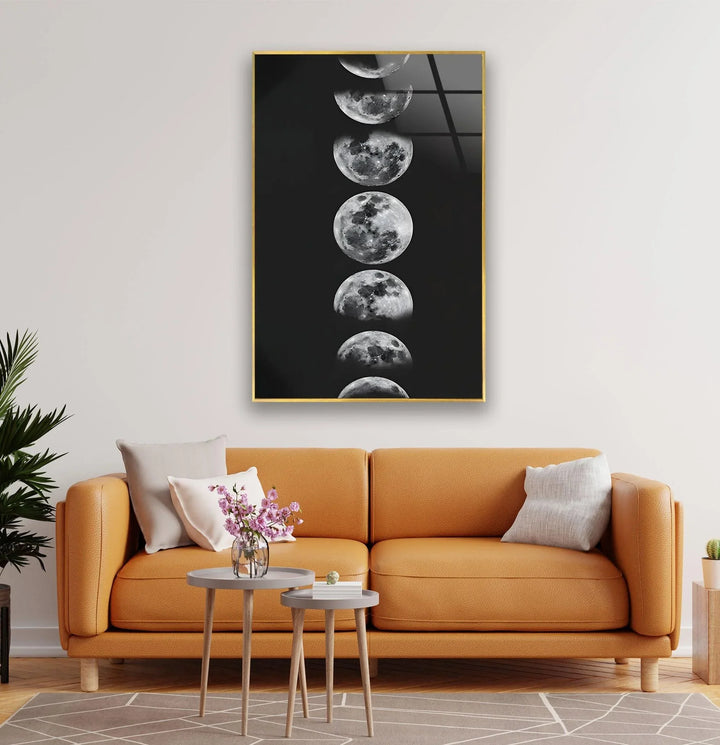 Black and white lunar artwork on glass capturing detailed moon transitions.