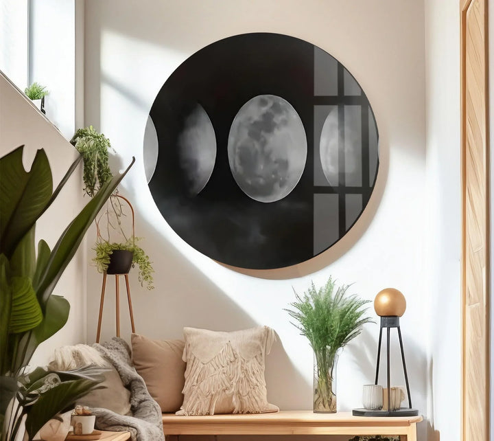 Moody celestial artwork on glass highlighting moon transitions within misty cloud formations.
