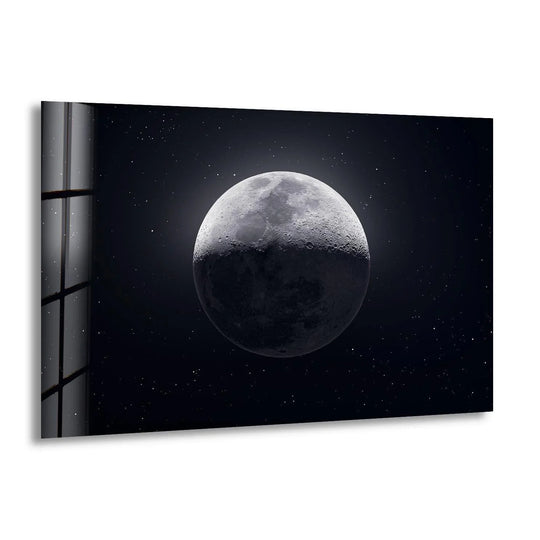 Half-lit moon against a starry night sky printed on sleek glass wall art.