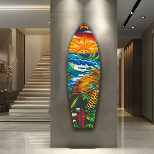 The surfboard wall art casts dramatic shadows, highlighting its vibrant pop art design with warm sunlight and cool ocean tones.
