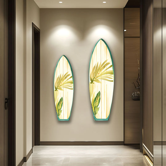 Vertical surfboard-shaped wall prints showcase green botanical accents, adding a touch of tropical flair to the modern decor.