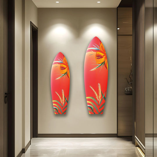 Vertical surfboard-shaped best glass art pieces feature a vibrant botanical red floral design, adding a tropical and stylish touch to the wall decor.