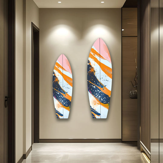 Two vibrant surfboard hanging wall art pieces, showcasing orange and white color splashes, dominate the focal point against a neutral backdrop.